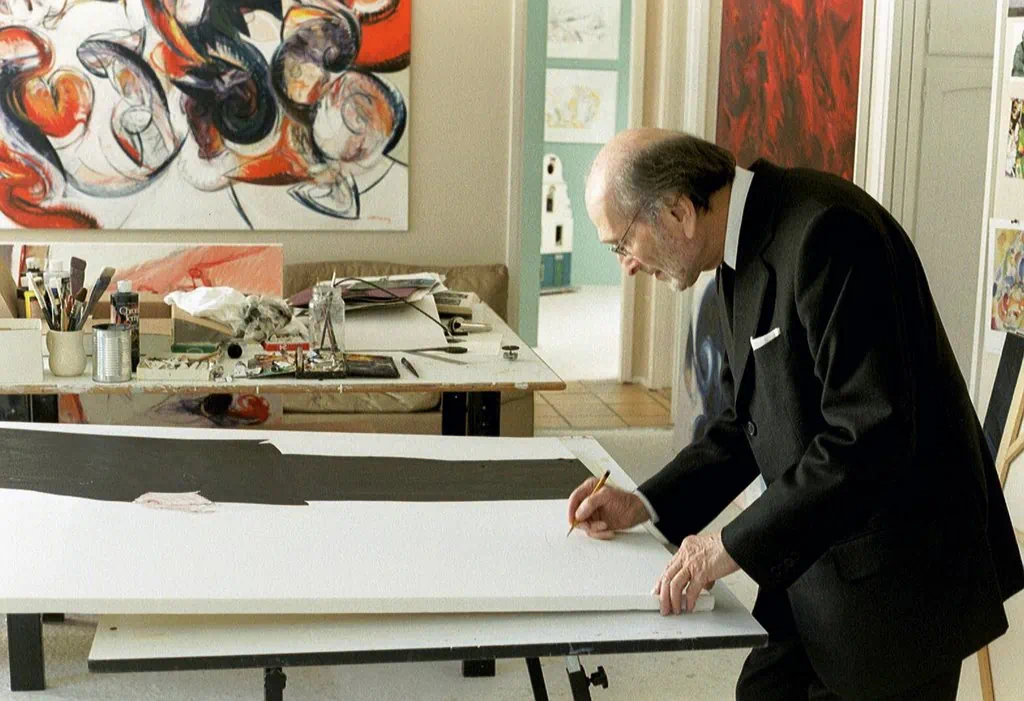 Abraham Rogatnick signing his portrait in Peter John Voormeij's studio